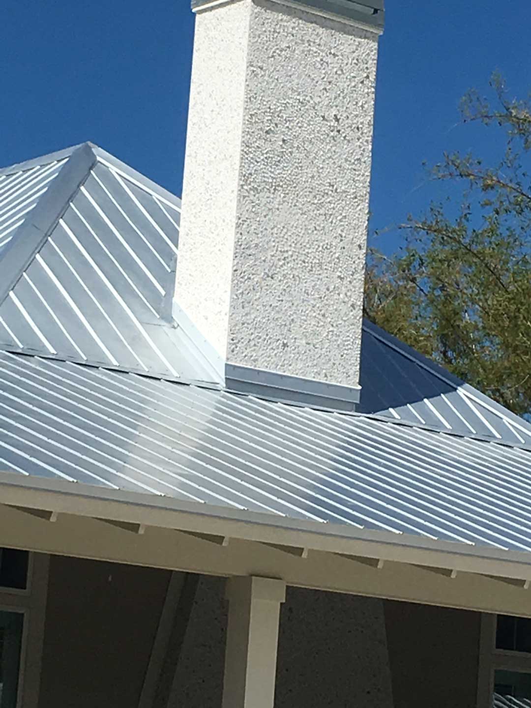 Completed 24 ga. 5V Metal Panel Roof with Chimney Flashing in Manatee County, FL