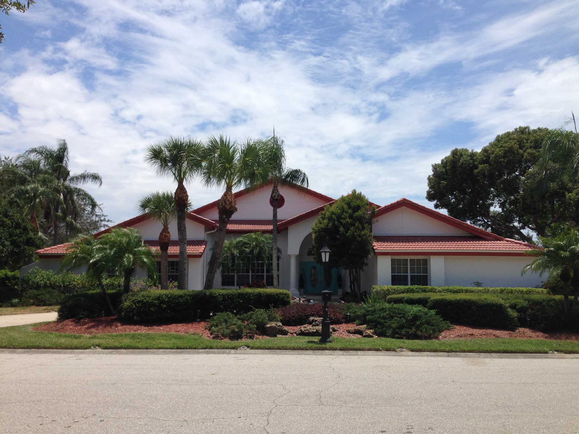 Completed Eagle Malibu Tile Roof in Kona Red Range in Sarasota County, FL